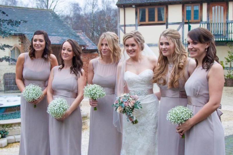 five bridesmaids displaying complementary autumn bridesmaid makeup looks