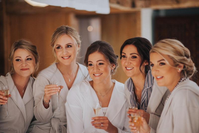Bridesmaids laughing together with long lasting makeup