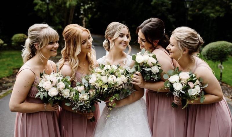 Group of bridesmaids in matching makeup looks for summer wedding