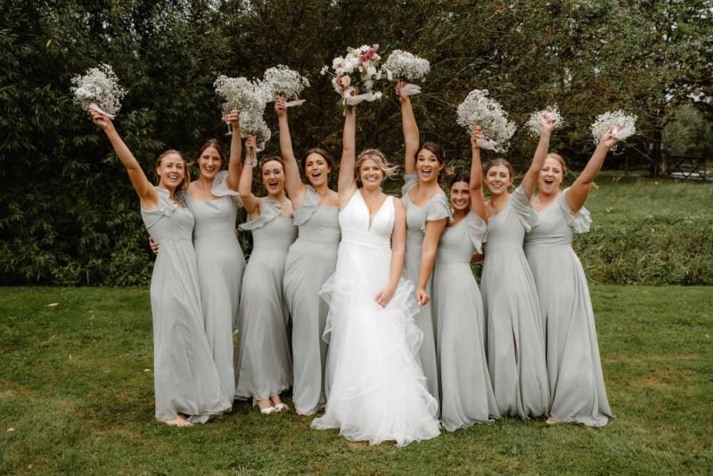 Group of bridesmaids with matching fresh faced makeup and bride