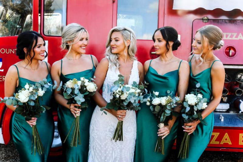 Group of bridesmaids in matching makeup looks for summer wedding
