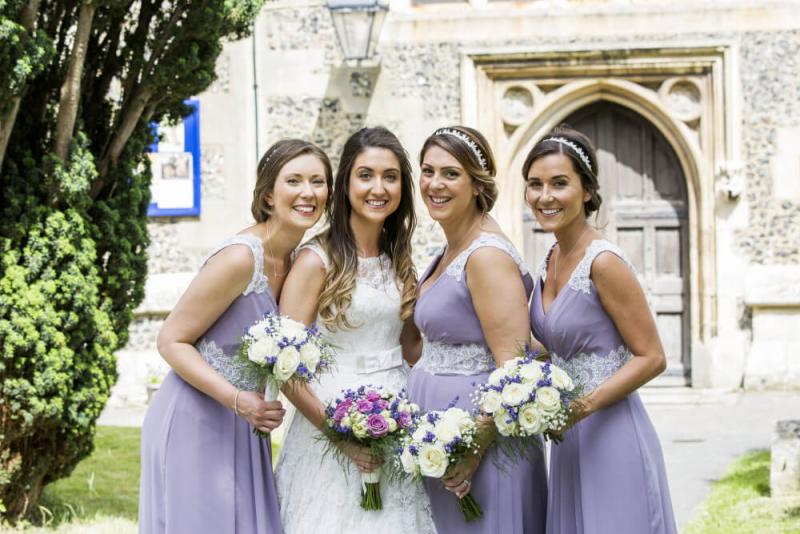 Group of bridesmaids in matching makeup looks for summer wedding