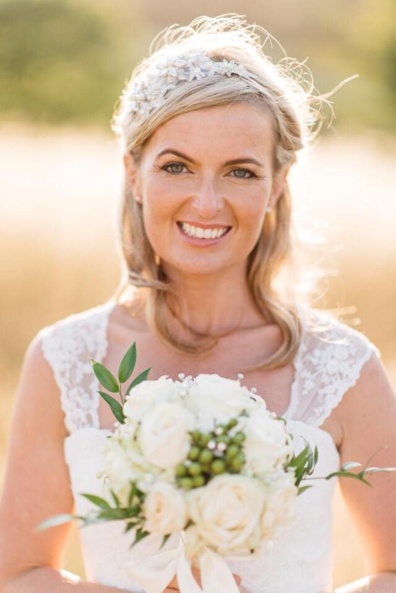 becca-gray-wedding-portfolio-1516613653.jpg blonde haired bride with makeup and flowers