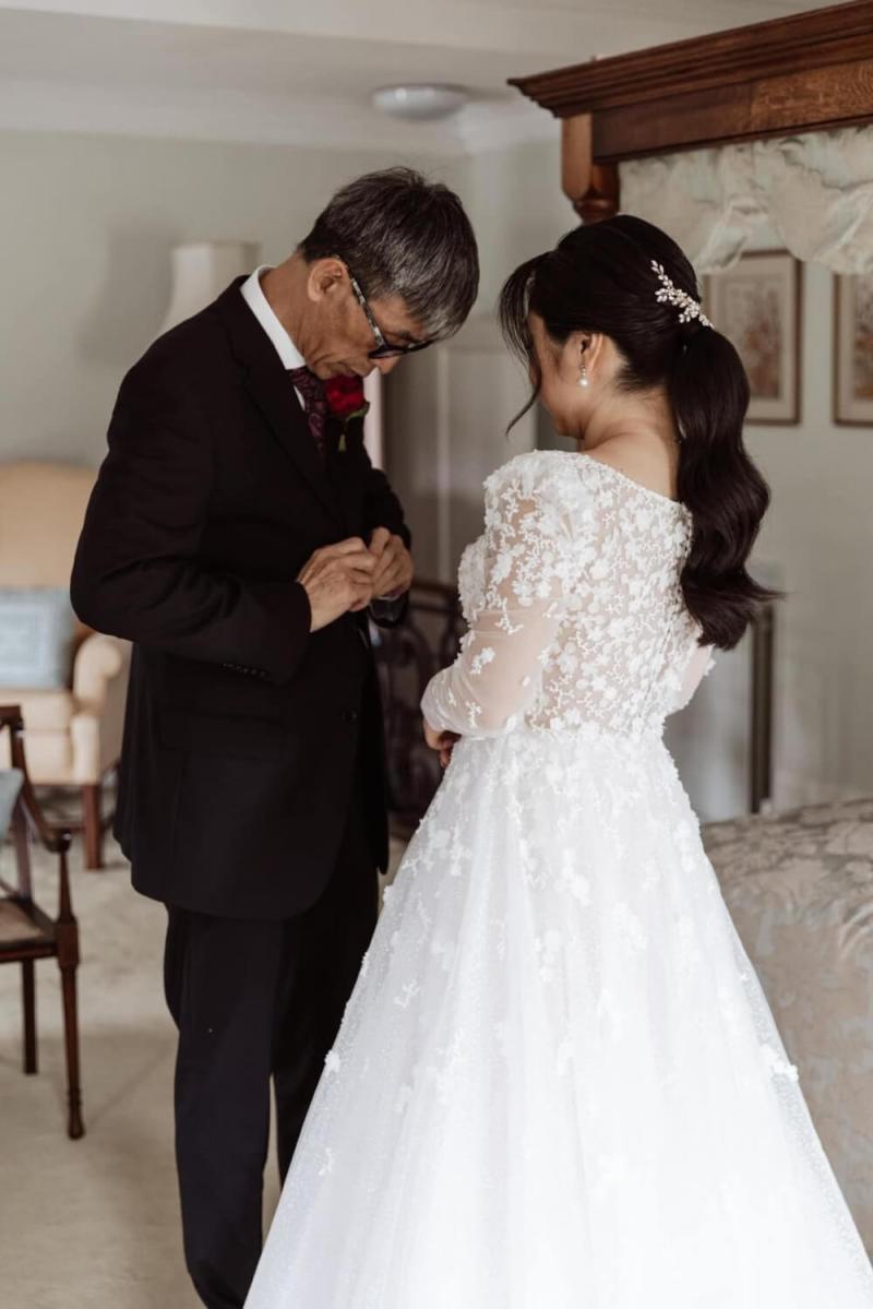 big-hair-energy-by-tiel-wedding-portfolio-1689287335.jpeg bride with long lace sleevs and groom