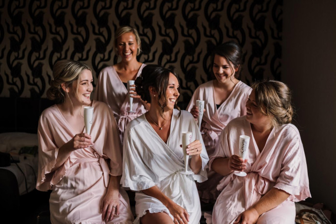 This bridal party wanted a uniform look so a low bun with twists either side was decided. The bride went for a hair style that gave her volume while keeping it soft around her face. - Make Me Bridal Artist: Flawless essence. Photography by: Rachel Elizabeth. #updo #bridesmaidhair #lowbun