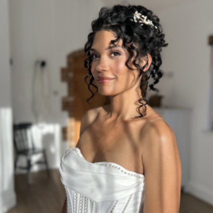 Working with natural Afro curls, twisted up into a high structured bridal bun - #bohemian #classic #vintage #glamorous #curls #weddingmorning #bridalmakeup #bridalhair #afrohair