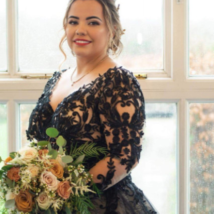 This bride wanted full glam makeup with a red lip and a lovely textured updo - #bridalmakeup #bridalhair #redlip #glammakeup #christmaswedding #texturedupdo