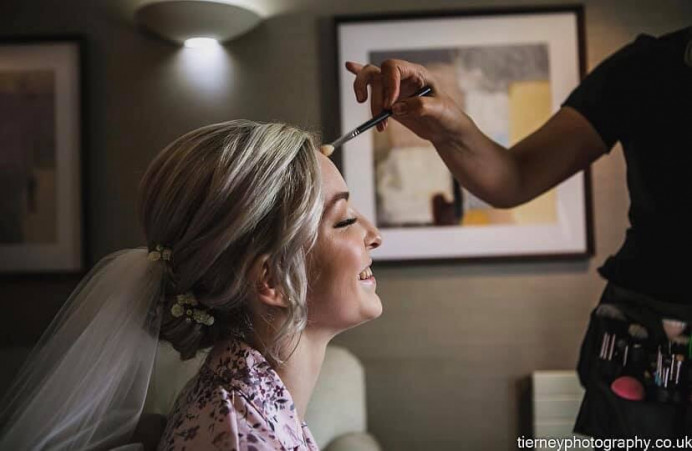 This shot just displays the pure happiness of the bride on her wedding day. It makes me so happy to know that when a bride is in my chair she can feel totally relaxed and can enjoy her wedding morning. - Make Me Bridal Artist: Natasha Jane makeup . Photography by: Mark tierney .