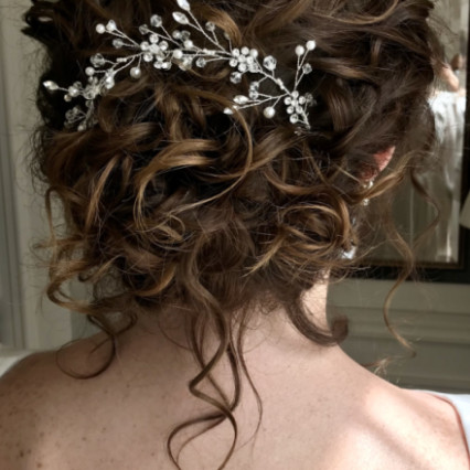 My bride wanted me to work with her natural curl (and stop the frizz) to create a loose feeling updo. Her look was romantic, classic and defined. - #curls #updo #smoothcurls #naturalhair