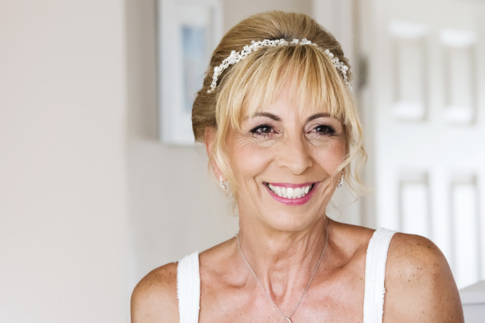 Such a fabulous Bride with a fabulous smile who wanted a smokey eye with pinks and browns. She is also wearing a very soft subtle pair of Red Cherry lashes. - Make Me Bridal Artist: Tania Claire Makeup Artist. Photography by: Amy Slater. #airbrushedmakeup #bridalmakeup #weddingmakeup #makeupartist #beautifulbridalmakeup #surreymakeupartist #matureskin #crueltyfreebride #maturebride