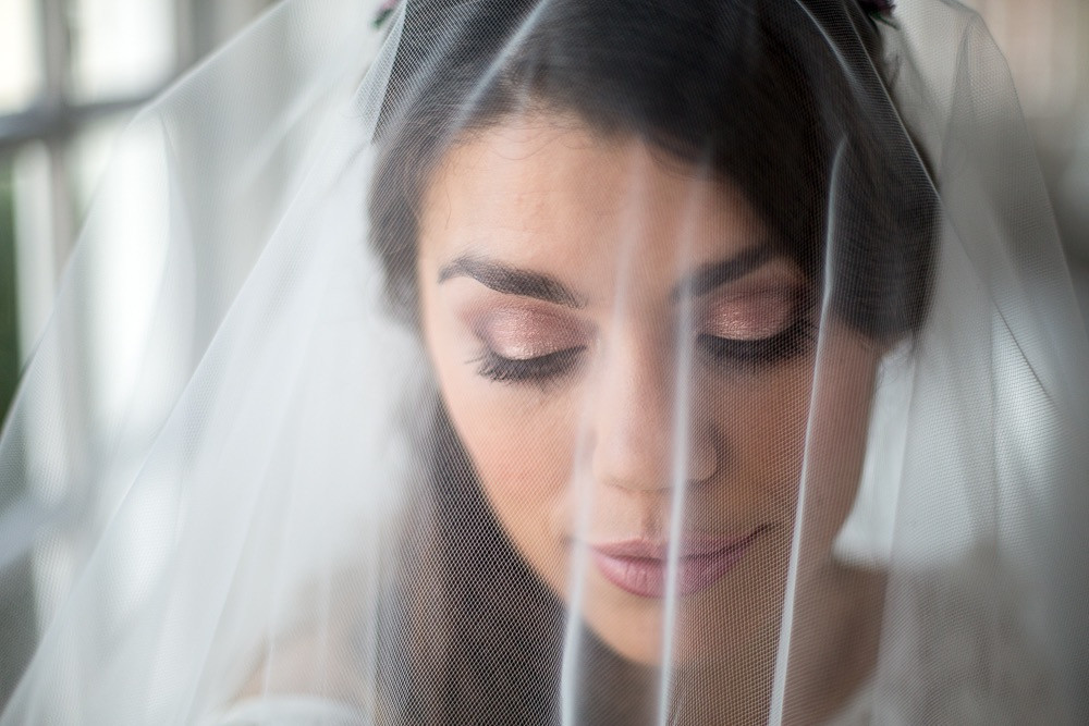 Beautiful bride with soft pink shimmering eye makeup with veil - Make Me Bridal Artist: Makeup Angel. Photography by: John Knight. #classic #boho #naturalmakeup #curls #bridalmakeup #elegant #perfectmakeup #makeup #bridalmakeupartist #veil #flawlessmakeup