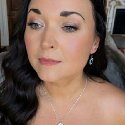 Elegant soft Glam bridal lit-from-within radiance. The bride wanted skin that felt like skin—lightweight and breathable—but with the staying power to last from the first look to the final dance.
 Eyes: Soft nude shadows blended with delicate pearl shimmers for that extra dazzle, defined by a sweeping eyeliner flick and wispy corner lashes.
Lips: The perfect creamy nude/pink lipstick to complete this elegant look. - Photography by: Makeup By Lisa Hannah. #bridalmakeup