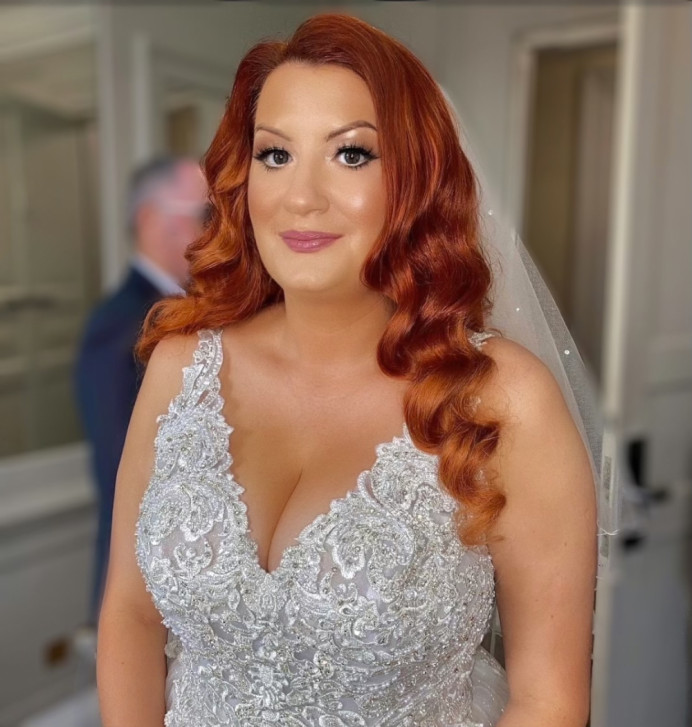 My brief was, 'I want to look like Jessica Rabbit!'...
And so that's exactly what I did.
Katie has the most glorious vibrant copper hair, so I was thrilled when she said she wanted Hollywood waves, as I knew it was the style for her.
A full head of clip ins really added great volume and length, and acted as scaffolding for her natural hair to sit on.
Doesn't she look out of this world amazing?! - Make Me Bridal Artist: Max It Up Bridal & Special Occasion Hair. Photography by: Natalie Mason. #hollywoodwaves #hairdown #loosewaves #oldhollywood #hollywoodglamour #vintagewaves #vintageglamour #classichair #classicbride #waves #romantichair #beautifulelegantbride #elegantbride