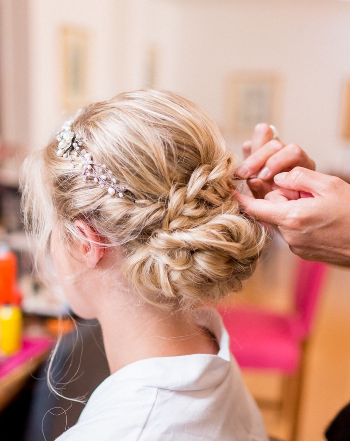 Finishing touches to this bride’s plaited up do. - Make Me Bridal Artist: Amanda Roberts Hair & Makeup. Photography by: Philippa Sian . #boho #blonde #hairvine #weddingmorning #bridalhair #braid #braidedupdo #weddinghair #plait #finaltouches
